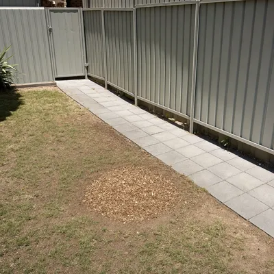After: Stump grind through a narrow side gate in Battery Point, Hobart